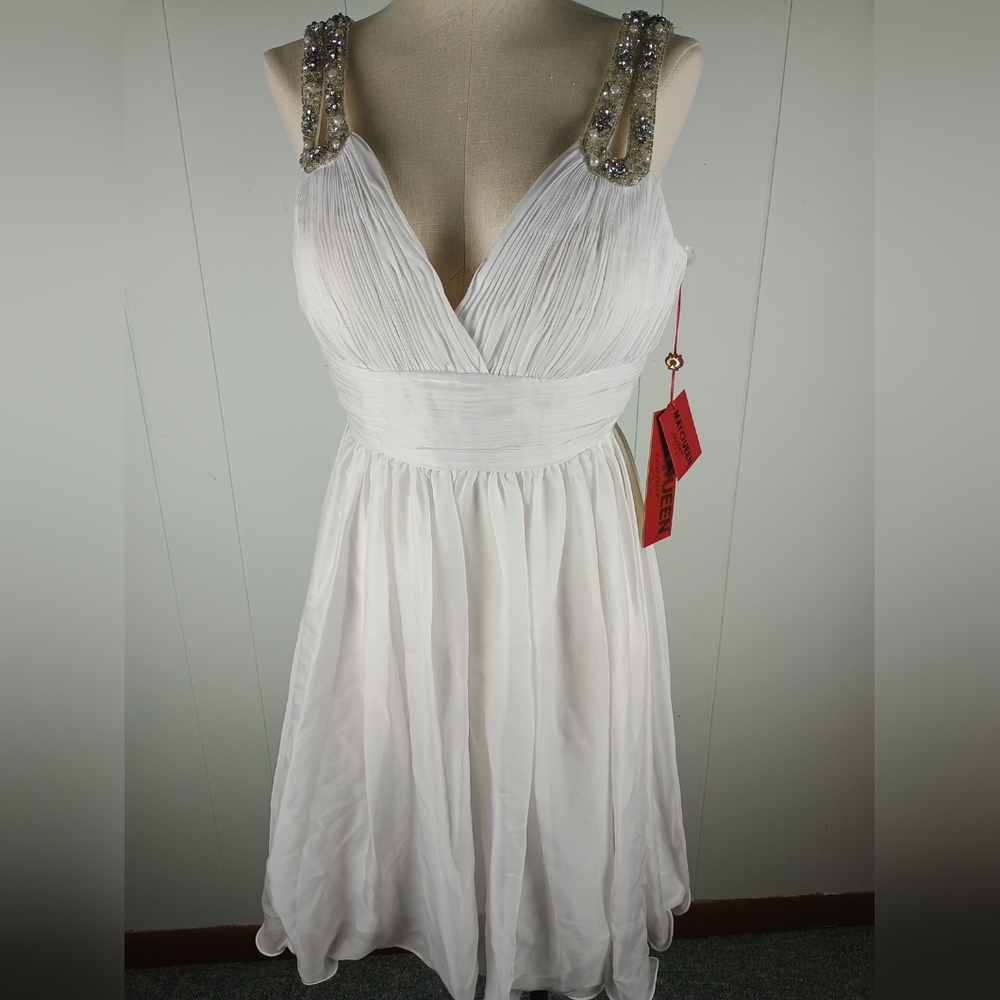 Elegant White Gown with Embellished Straps